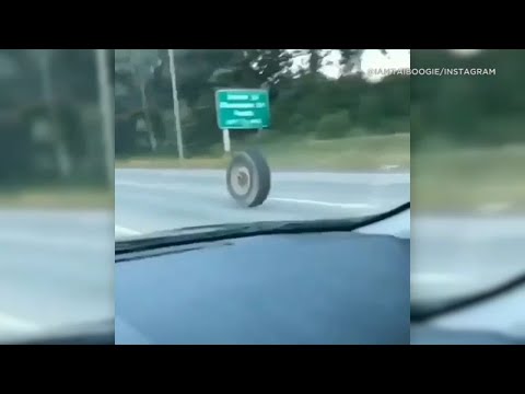 Free truck tire rolls and bounces down Contemporary Jersey toll road, smashes into Jeep | ABC7