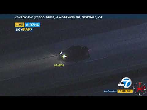 Authorities in pursuit of presumably armed suspect in stolen automobile in Palmdale place of dwelling