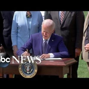 Biden signs electrical automobile executive repeat, praises autoworkers
