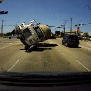Cement truck tipped into vehicle