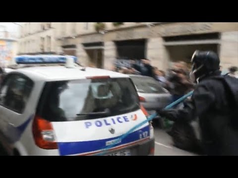 Protesters torch police vehicle at some stage in Paris demonstrations
