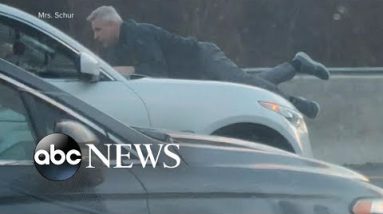 Man clings to the roof of rushing vehicle all the way by avenue rage incident