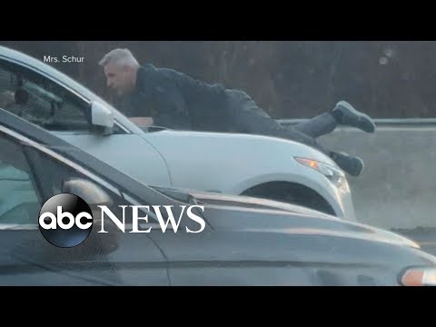 Man clings to the roof of rushing vehicle all the way by avenue rage incident