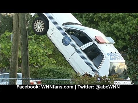 Miami Police Automobile Drives Up Utility Pole