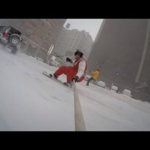 Look This Daredevil Snowboard By Unusual York City Being Pulled by a Car