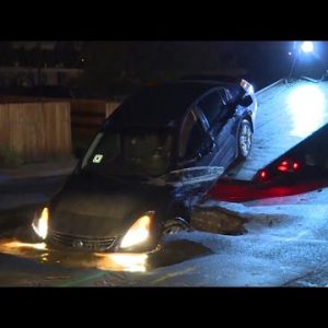 Uber driver’s vehicle crashes into broad sinkhole