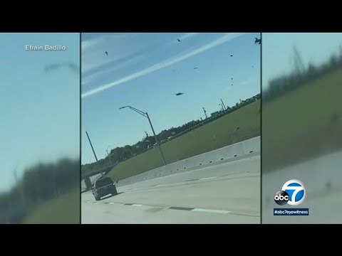 Video reveals debris falling onto dual carriageway after 2 plane wreck mid-air for the interval of Dallas WWII airshow