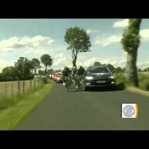 Tour de France riders clipped by files automobile