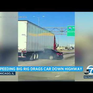 Video: Giant rig drags automobile down highway with driver pinned underneath trailer l ABC7