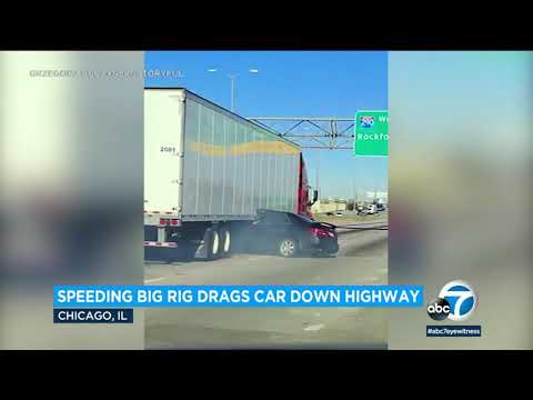 Video: Giant rig drags automobile down highway with driver pinned underneath trailer l ABC7