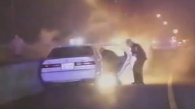 Law enforcement officers Save Man From Burning Car [DASH CAM VIDEO]
