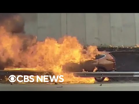 Burning automotive rescue caught on digicam