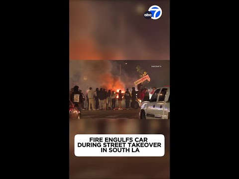 Fire engulfs automobile at some level of avenue takeover at South LA intersection