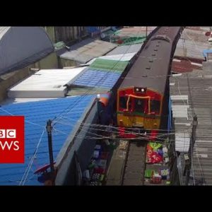 The prepare that drives by a market – BBC News