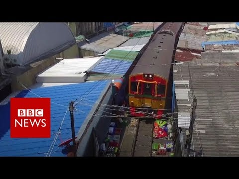 The prepare that drives by a market – BBC News